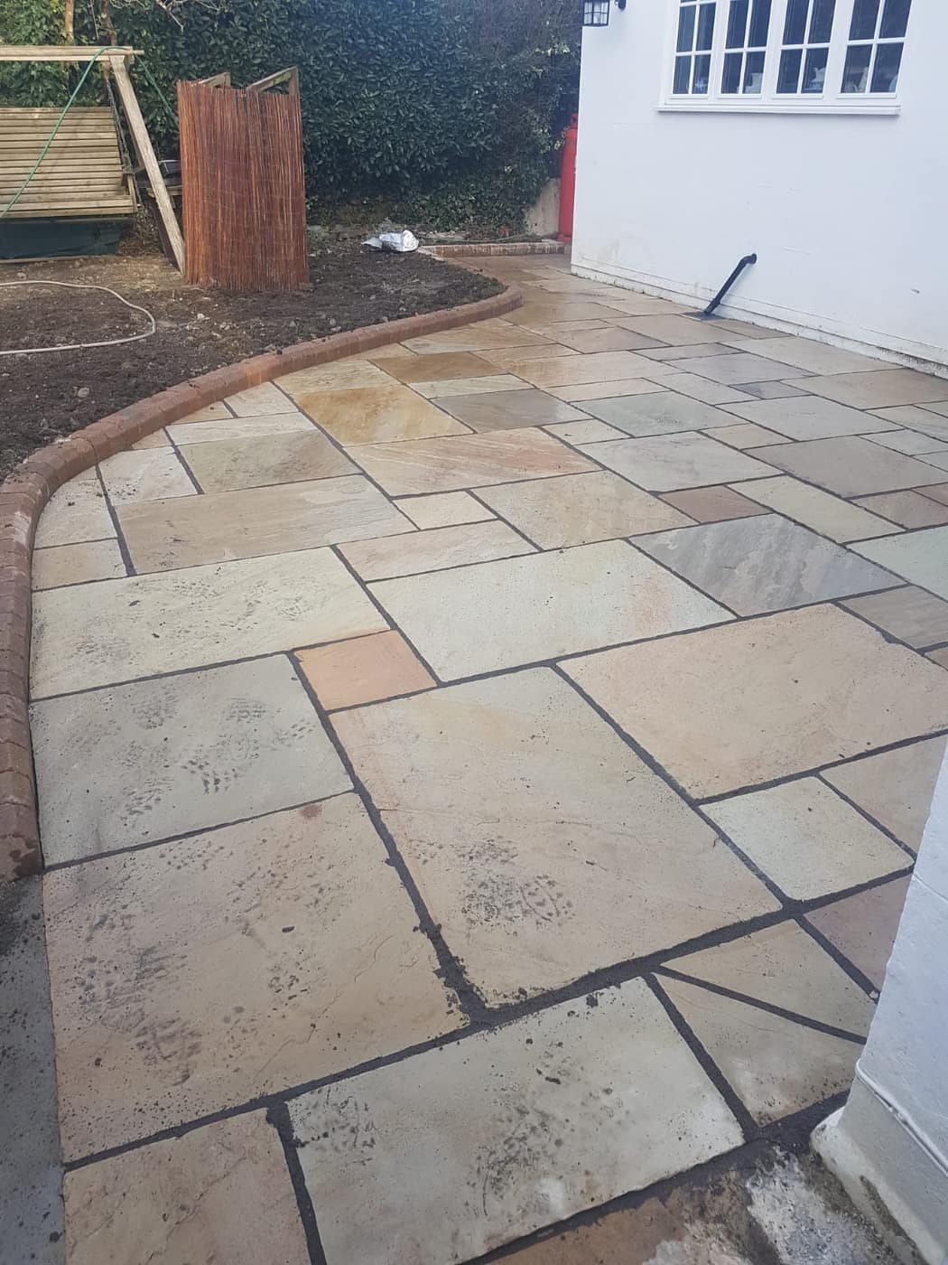 Sandstone patio laid by South East Groundworks