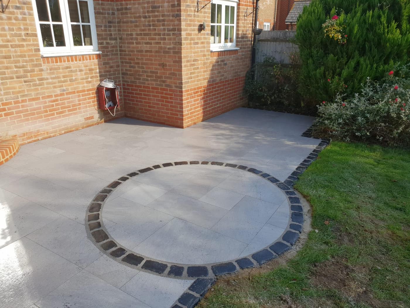Grey porcelain patio laid by South East Groundworks