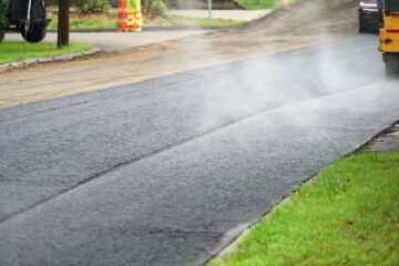 road pavement in residential area with steam Recommended Road Surfacing company Kent